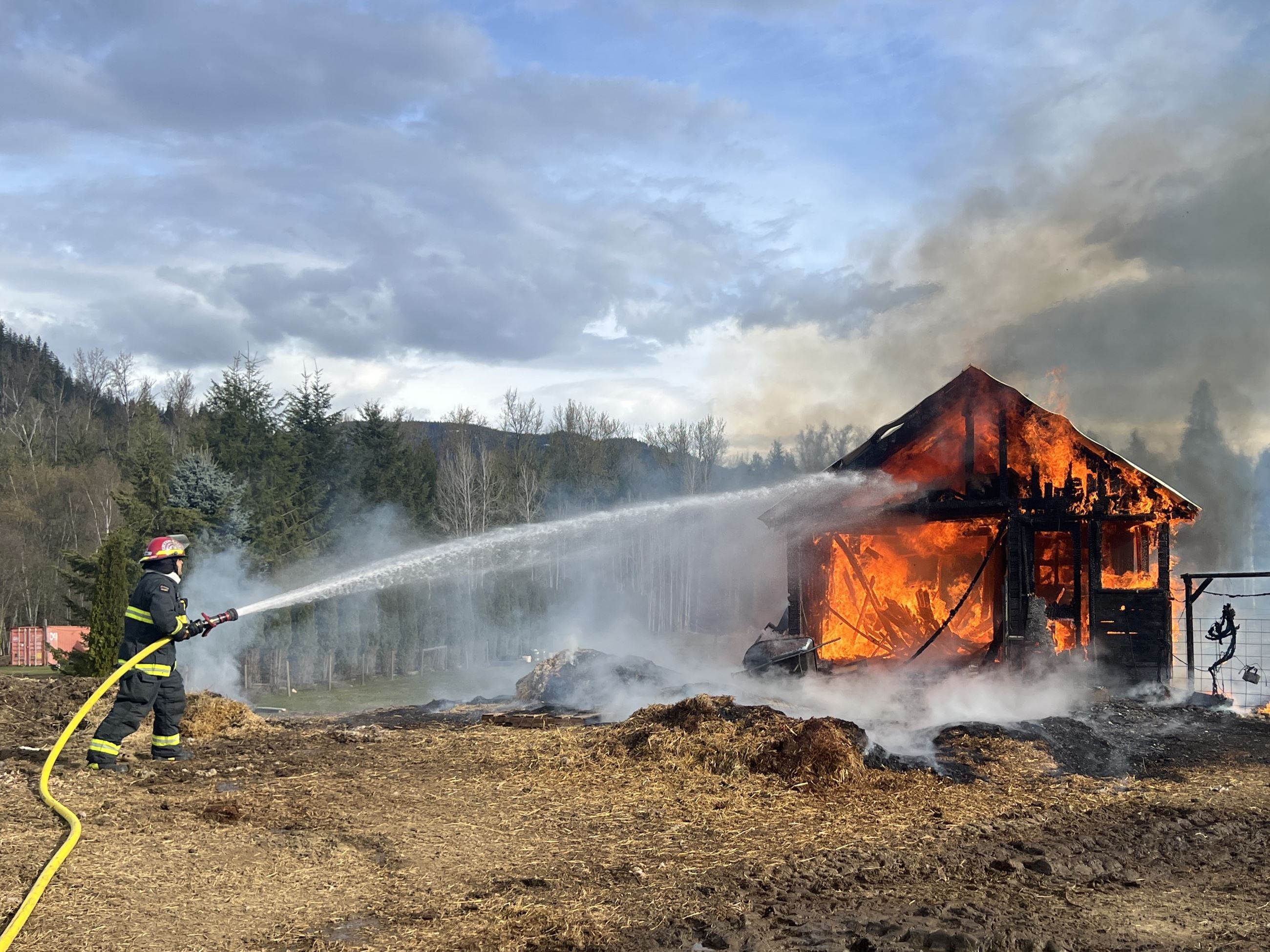 Fire Crews Extinguishing Big Eddy Structure Fire