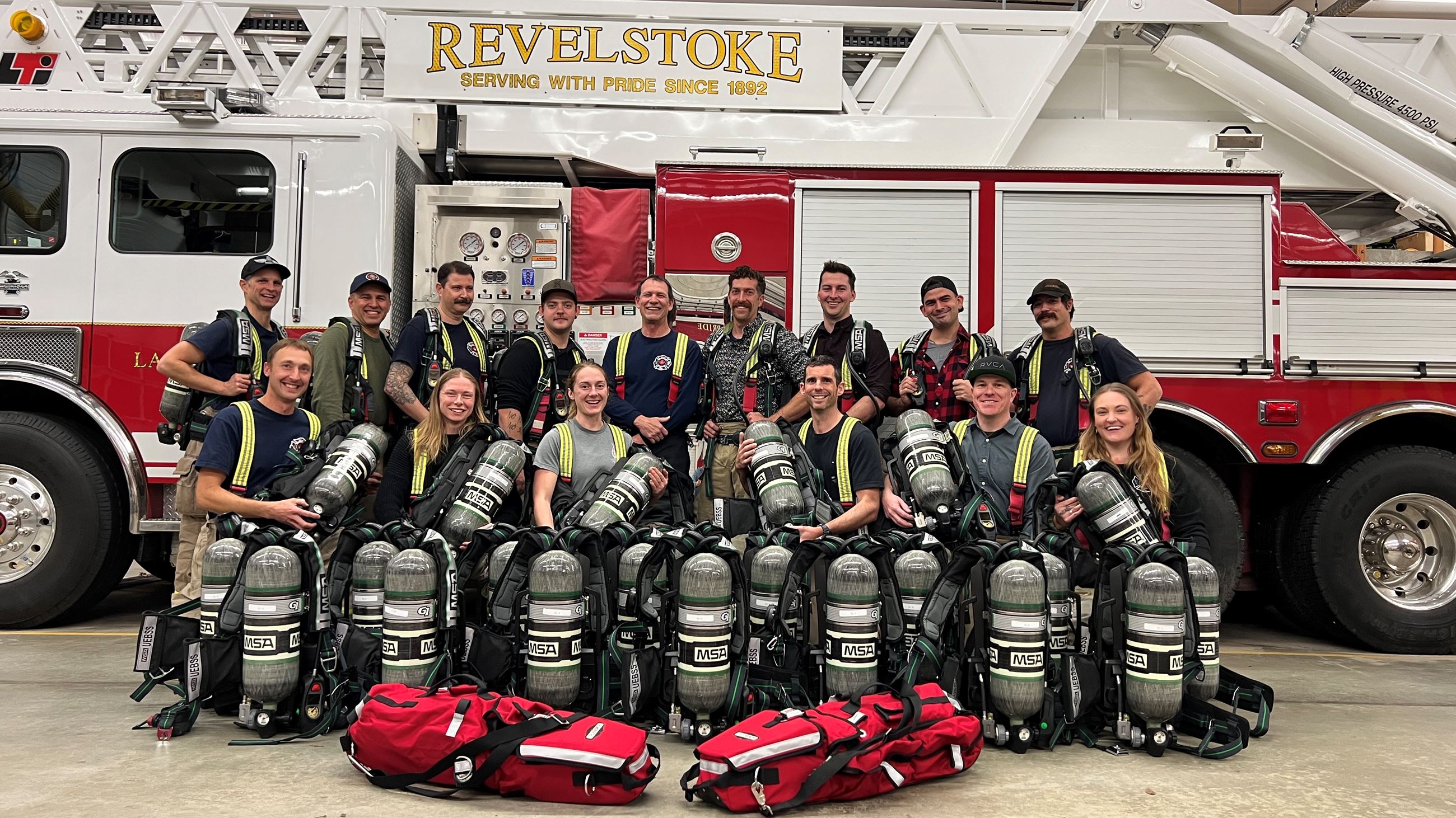 Revelstoke Fire Department Group Photo in front of Fire Engine